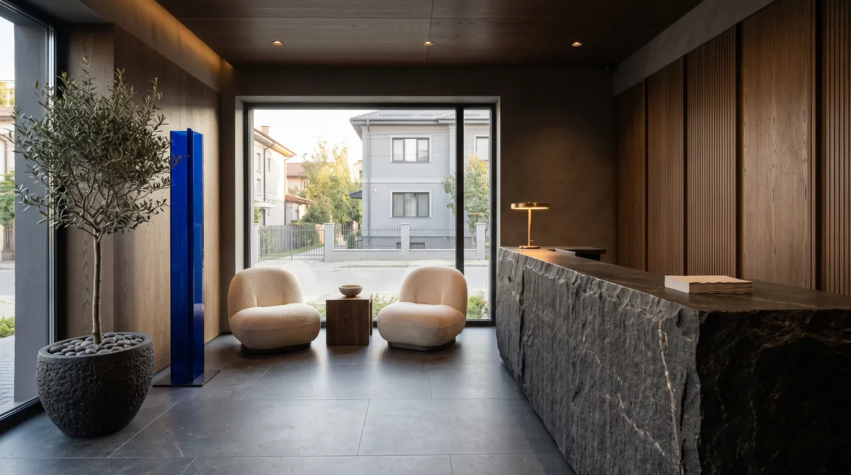 The Smalț reception: a stone desk, two armchairs, an olive tree